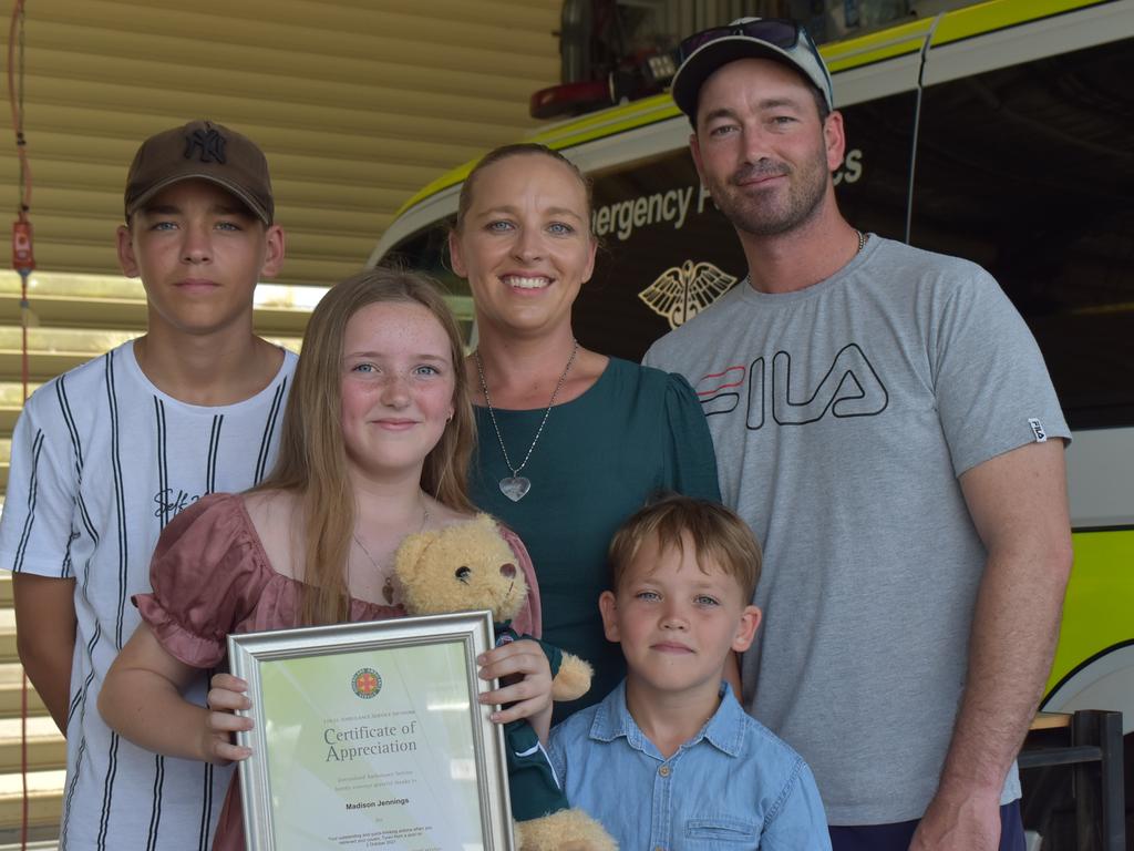 Madison Jennings accepted her certificate of appreciation at Mackay South Ambulance station with her eldest brother Dustin, youngest brother Ashton and mother and father Troy and Tinneile Jennings. Picture: Lillian Watkins