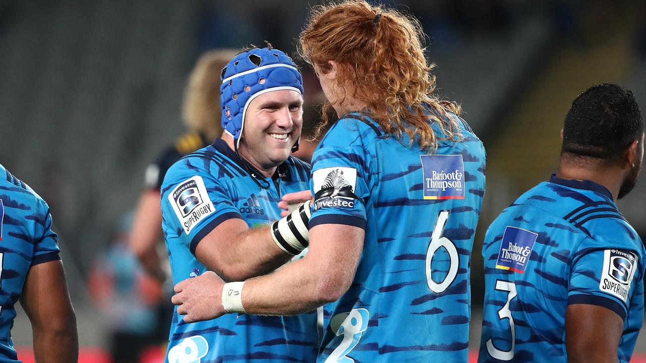 The Blues celebrate the win against the Highlanders at Eden Park.