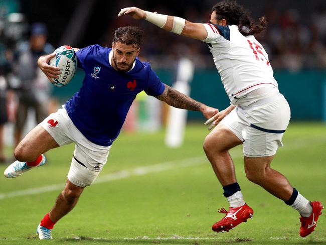 France centre Sofiane Guitoune looks to get past USA fullback Mike Te’o. Picture: Getty Images