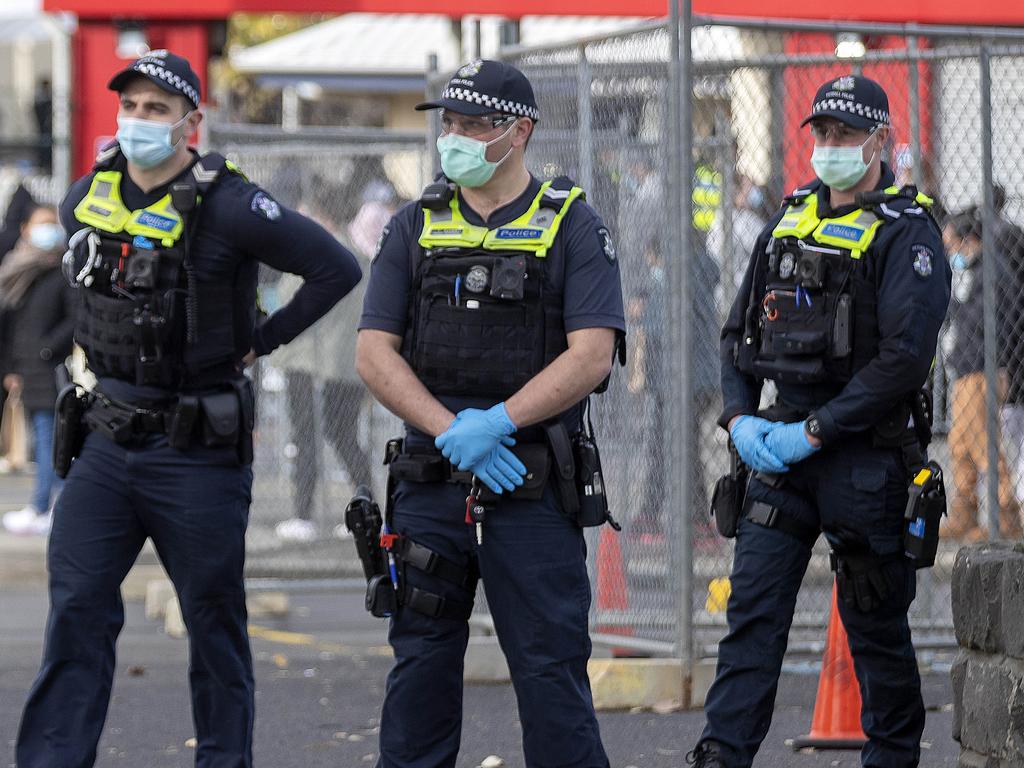 Police on the lookout for protesters at the Sandown Racecourse vaccination centre. Picture: NCA NewsWire/David Geraghty