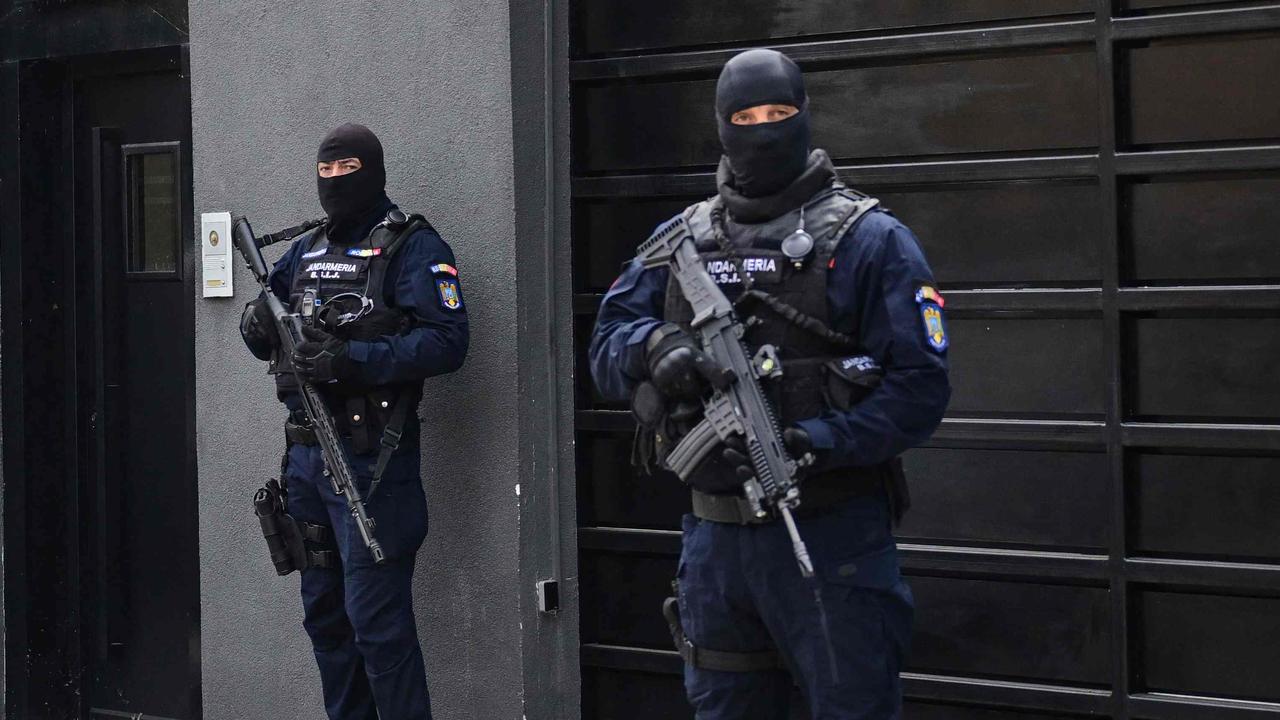 Romanian gendarmes are pictured in front of Andrew and Tristan Tate's residency. Picture: Daniel Mihailescu/AFP