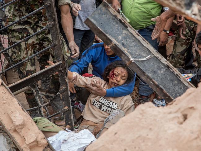 Emergency rescue workers find a survivor in the debris of Dharara tower after it collapsed in Kathmandu, Nepal. A wide variety of often conflicting traits can be attributed to those who cope best with life-threatening situations.