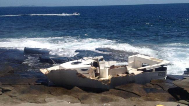 SAD SIGHT: The remains of the 26-foot motor cruiser that washed on to Old Woman Island on Sunday night. Picture: Joe Hoffman