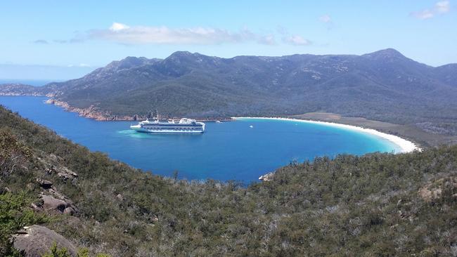 MUST CREDIT - Stephen Laird A cruise ship enters Wineglass Bay on the Freycinet Peninsular, Tasmania. MUST CREDIT - Stephen Laird