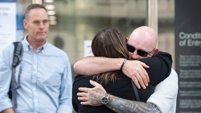 Tania Boyce, widow of hit-run victim Timmy Rakei, who was killed by Jason Ruscoe while working as a traffic controller in November 2021, is comforted by the surviving victim Shaun Kilmartin, after a plea hearing at the County Court of Victoria in February. PICTURE: NCA Newswire / Nicki Connolly