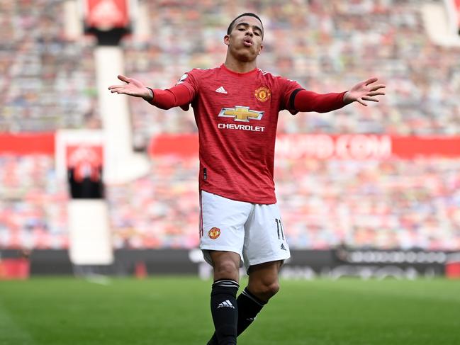 MANCHESTER, ENGLAND - APRIL 18: Mason Greenwood of Manchester United celebrates after scoring his team's second goal during the Premier League match between Manchester United and Burnley at Old Trafford on April 18, 2021 in Manchester, England. Sporting stadiums around the UK remain under strict restrictions due to the Coronavirus Pandemic as Government social distancing laws prohibit fans inside venues resulting in games being played behind closed doors. (Photo by Gareth Copley/Getty Images)
