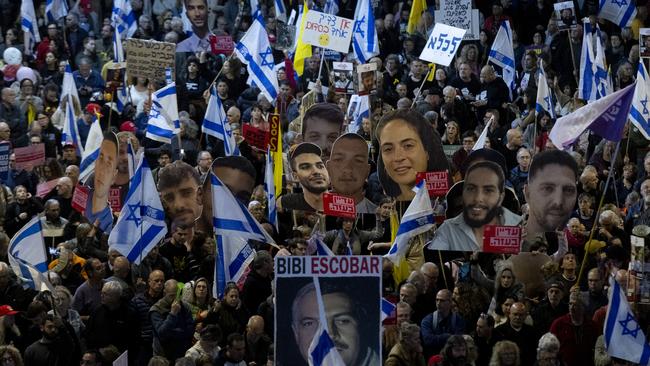 Photos of some of the Israeli hostages still held being held in Gaza are displayed at a rally in Tel Aviv on Saturday night. Picture:Amir Levy/Getty Images