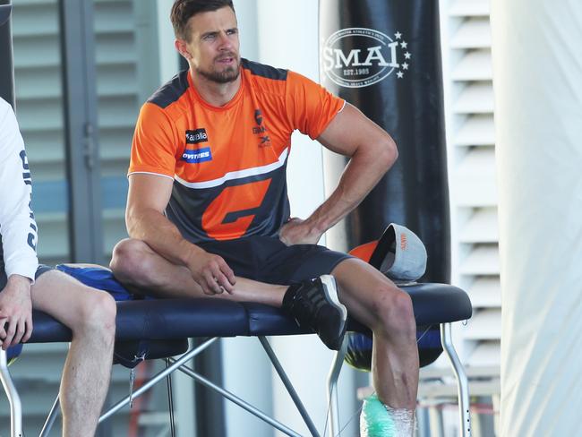 Deledio has his achilles strapped with ice following his workout. Picture: Phil Hillyard