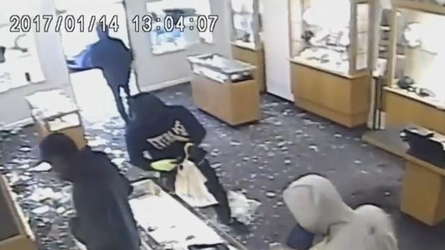 Armed gang members ransack the IMP Jewellery store in Toorak.