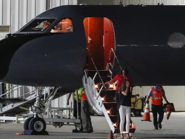 A crying woman exits the plane which brought Warmbier back to the US. Picture: AP