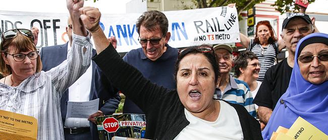 Barbara Coorey leads the protest outside the Metro Community Information Centre in Campsie. Picture: Carmela Roche