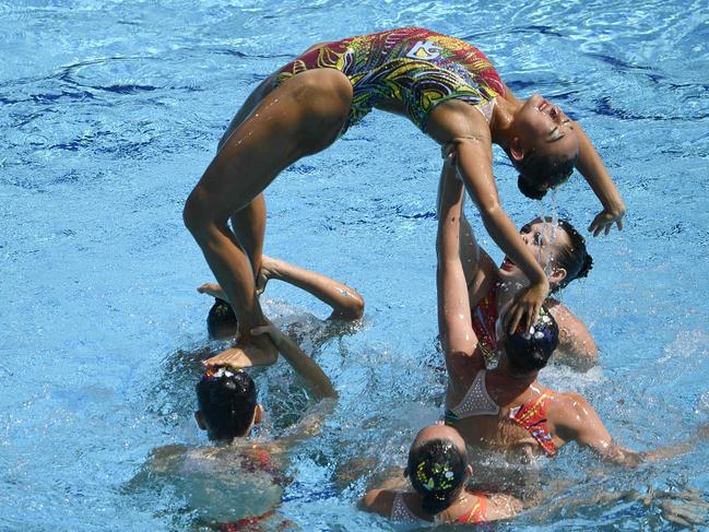 Team Australia competes in the Teams Free Routine final during the synchronised swimming event at the Maria Lenk Aquatics at the Rio 2016 Olympic Games in Rio de Janeiro on August 19, 2016. / AFP PHOTO / Martin BUREAU