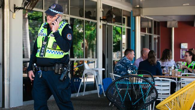 Police and Mosko’s Market Cafe supporters pictured on Thursday outside the cafe and Palmerston Library, the scene of Wednesday’s terrifying rampage. Picture: Glenn Campbell