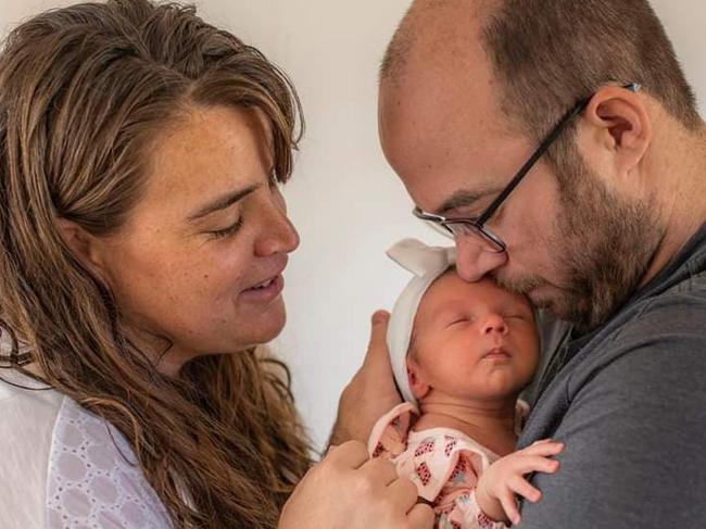 Baby Aniselle Othams-Schmiauke with her parents Sage and Marc. Picture: Supplied