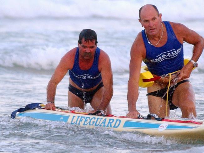 Mr Cook (left) pictured in 2005 held many swimming and surf life saving records. Picture: Bill Rosier