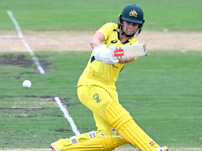 BRISBANE, AUSTRALIA - JANUARY 16: Phoebe Litchfield of Australia plays a shot during game one of the Womens One Day International series between Australia and Pakistan at Allan Border Field on January 16, 2023 in Brisbane, Australia. (Photo by Bradley Kanaris/Getty Images)