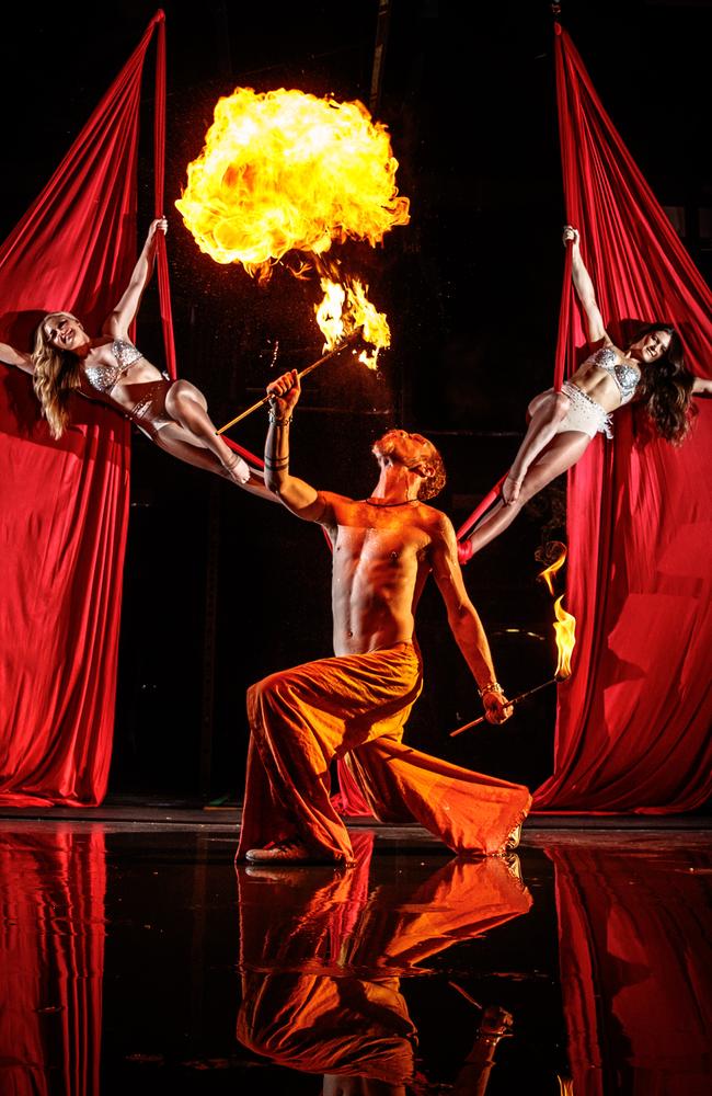 A firebreather from The Talents of Darkness and Jamie-Lee and Carmen from Le Aerial at CrossFit Mode, Adelaide. Picture: Matt Turner