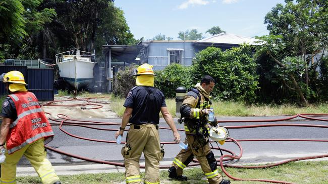 Queensland Fire and Emergency Services firefighters attend a large house fire at Christensen Street, Machans Beach. The blaze was contained quickly, with 6 fire trucks attending the emergency. No one was injured. Picture: Brendan Radke