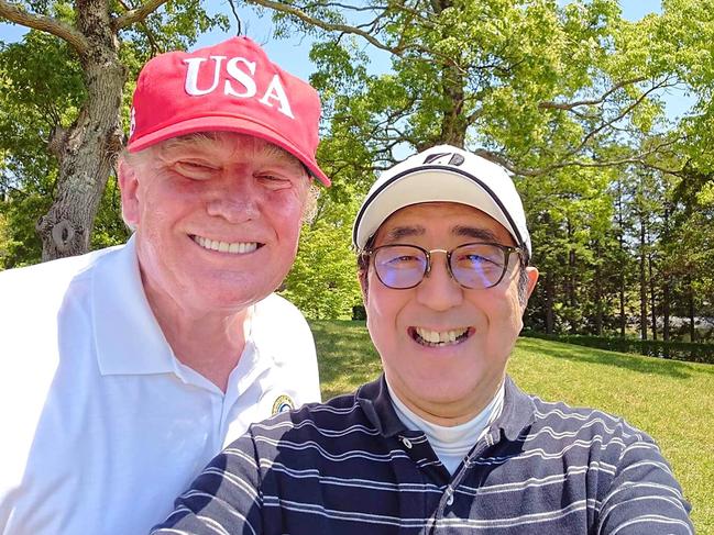 Donald Trump and Shinzo Abe take a selfie during a round of golf at Mobara Country Club in Chiba in 2019. Picture: AFP