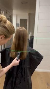 Aussie mum uses a laser to help cut daughter's hair