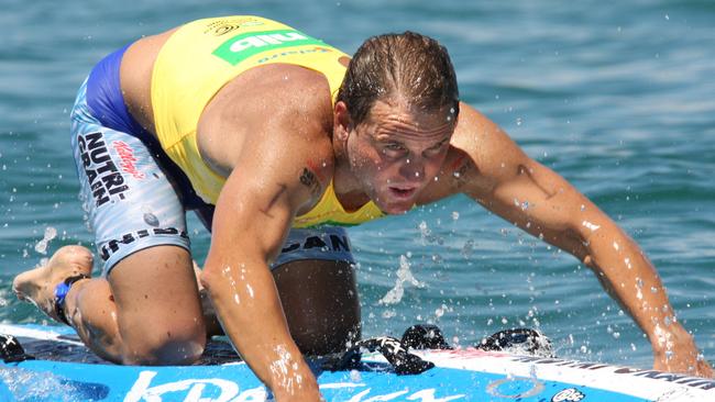 Ironman Dean Mercer competing in the Coolangatta Gold race on Gold Coast in Queensland.