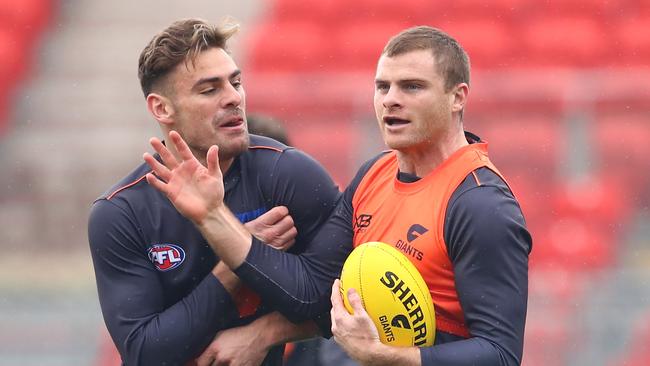 SYDNEY, AUSTRALIA - JUNE 27:  Stephen Coniglio of the Giants and Heath Shaw of the Giants interact during a Greater Western Sydney Giants AFL training session at Spotless Stadium on June 27, 2018 in Sydney, Australia.  (Photo by Cameron Spencer/Getty Images)