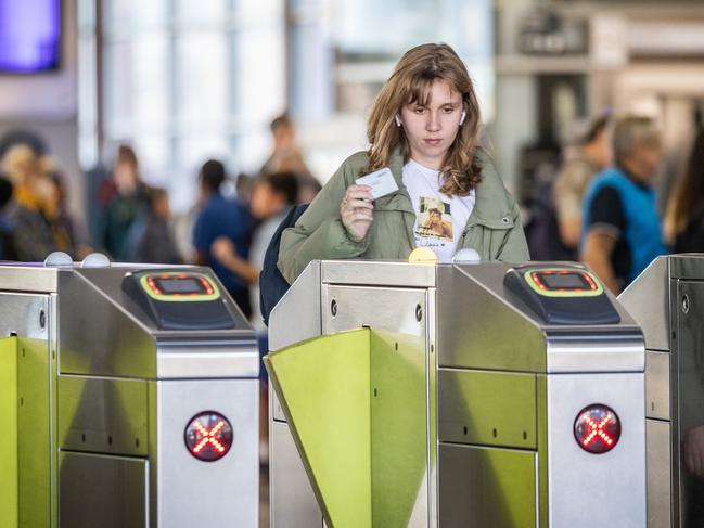 A NEW operator for Victoria's troubled Myki system will be announced today. Commuters use Myki cards at Flinders Street Station. Picture: Jake Nowakowski