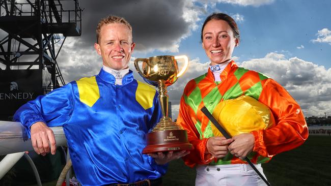 Jockeys Kerrin McEvoy and Katelyn Mallyon with the Melbourne Cup. Picture: Alex Coppel