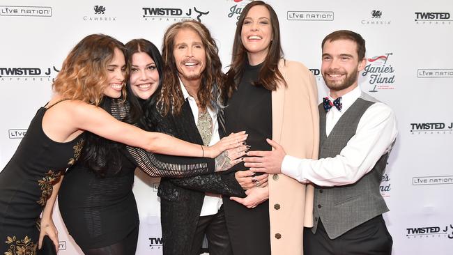 A pregnant Liv Tyler and fiance David Gardner with family.