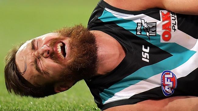 Charlie Dixon of the Power reacts after breaking his leg in the round 21 loss to the Eagles at Adelaide Oval. Picture: Daniel Kalisz/Getty Images