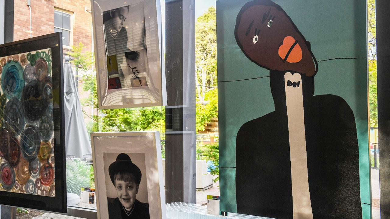 Elisa and Martin Manrique (pictured in the frames) were talented young artists. Elisa’s painting of singer Jason Derulo is on the right. St Lucy’s school held an exhibition that include their work.