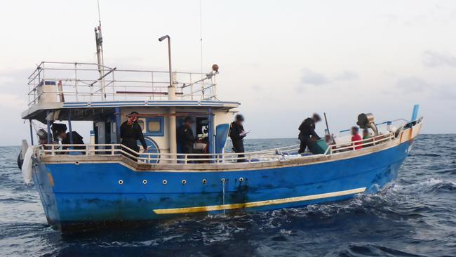 This boat carrying asylum-seekers from Sri Lanka was the third intercepted while trying to reach Australia since the federal election. The five men aboard were flown back to Colombo yesterday morning.