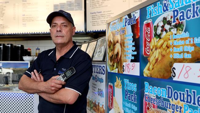 Sammy Klementou, owner of Sammy's Fish and Chippery has lost $20k over three years due to prank phone call orders. He says he get 40 to 60 calls per day. Picture: Kelly Barnes