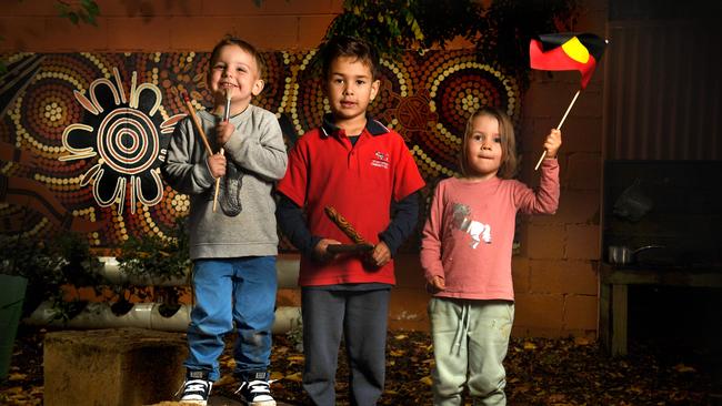 Finn 4, Quann 6 and Elena 3, in front of one of the indigenous art murals displayed at Sturt Street Children’s Centre. Picture: Tricia Watkinson