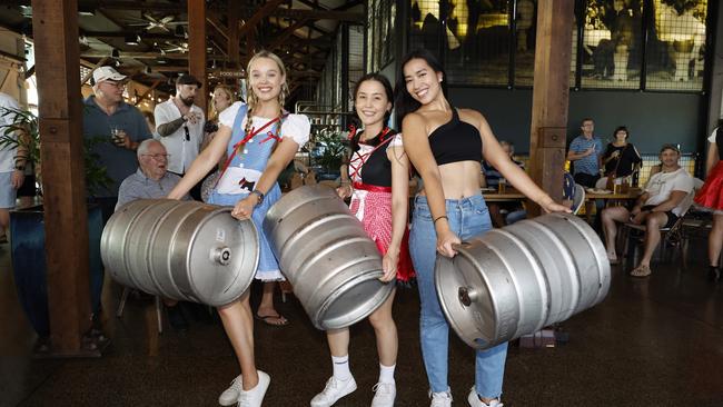 The German beer festival Oktoberfest was held at Hemingway's Brewery on the Wharf on Sunday afternoon. Grace Howes, Kaitlyn Horne and Mtari Soerono tested their strength in the keg lifting competition. Picture: Brendan Radke