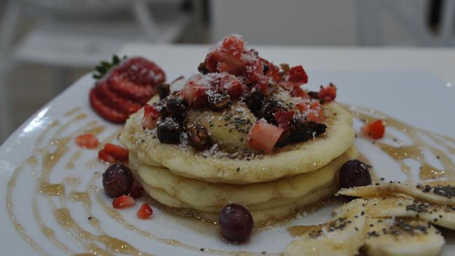 Protein pancakes with mixed fruit and sugar-free maple syrup from Nutrition Station Castle Hill. Picture: Stacey Roberts