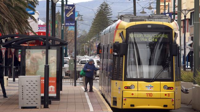 SA man Danny Piscopo and his son Harrison, 3 years old, from Upper Sturt, about to catch the tram from Glenelg to Adelaide.