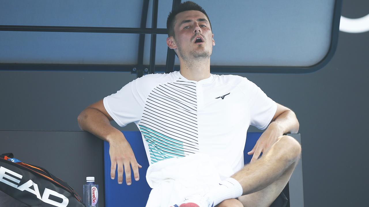 Bernard Tomic looks exhausted in his Australian Open qualifying match.