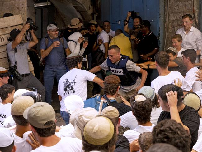 Israelis attack members of the press during the Jerusalem Day Flag March in the Old City. Picture: Getty Images