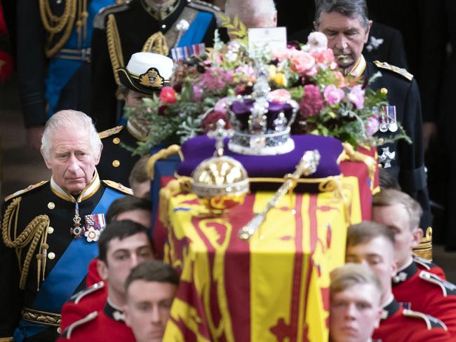 LONDON, ENGLAND - SEPTEMBER 19: King Charles III follows behind the coffin of Queen Elizabeth II, draped in the Royal Standard with the Imperial State Crown and the Sovereign's orb and sceptre, as it is carried out of Westminster Abbey. after the State Funeral of Queen Elizabeth II on September 19, 2022 in London, England. Elizabeth Alexandra Mary Windsor was born in Bruton Street, Mayfair, London on 21 April 1926. She married Prince Philip in 1947 and ascended the throne of the United Kingdom and Commonwealth on 6 February 1952 after the death of her Father, King George VI. Queen Elizabeth II died at Balmoral Castle in Scotland on September 8, 2022, and is succeeded by her eldest son, King Charles III. (Photo by Danny Lawson - WPA Pool/Getty Images)