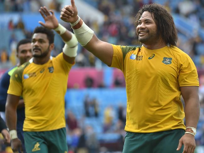 Australia's hooker Tatafu Polota-Nau (right) gestures on the pitch after the Pool A match.