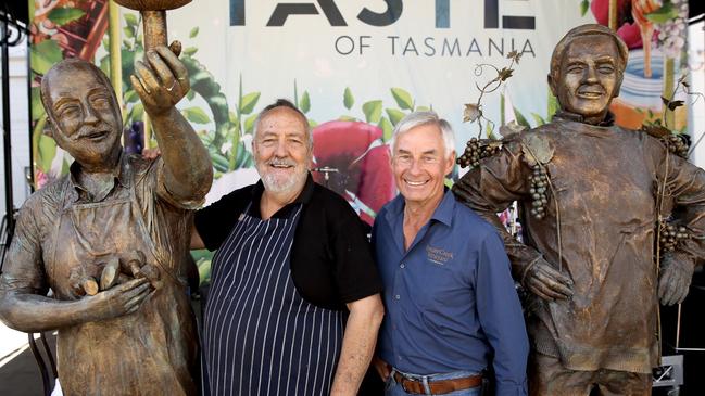 John Caire of Festival Tempura Mushrooms and Fred Peacock of Bream Creek Vineyard and the statues created in honour of their 30 years of Taste participation.