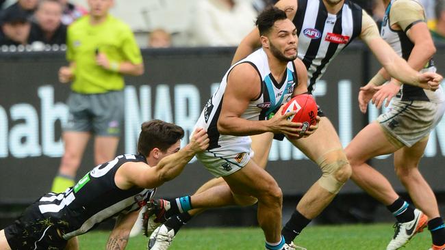 Jarman Impey breaks a tackle against Collingwood. Picture: AAP