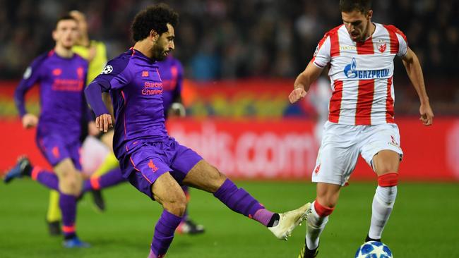 Degenek takes on Liverpool’s Mohamed Salah for Red Star in the Champions League. (Andrej ISAKOVIC / AFP)