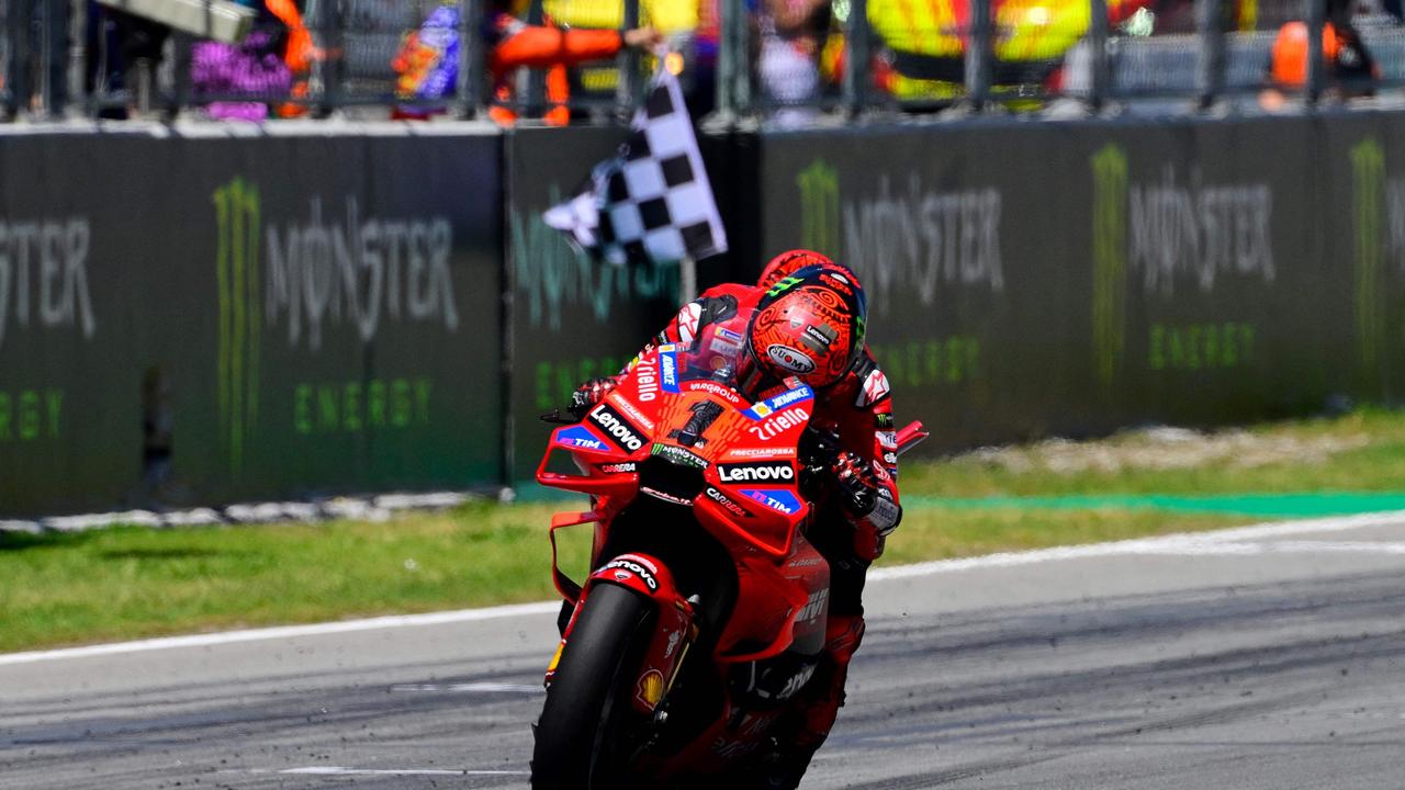 Ducati Italian rider Francesco Bagnaia crosses the finish line in first place during the MotoGP Race of the Moto Grand Prix of Catalonia at the Circuit de Catalunya on May 26, 2024 in Montmelo on the outskirts of Barcelona. (Photo by Josep LAGO / AFP)