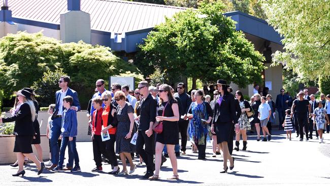 The husband and son of Cindy Low, Matthew and Kieran (left), depart with other mourners after her funeral at the Palmdale Hillside Chapel on the Central Coast, on November 3.