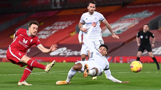 Liverpool’s Diogo Jota shoots past Leicester City defender James Justin