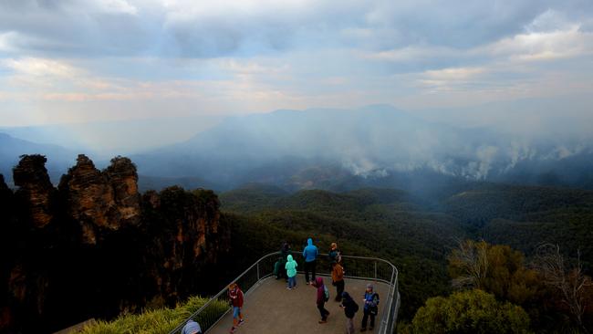 Smoke is seen as a fire continues to burn in Katoomba, Blue Mountains. Picture: Jeremy Piper