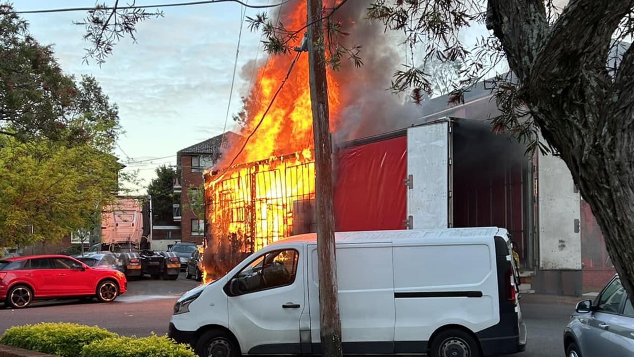 Truck engulfed in flames after bringing down power lines