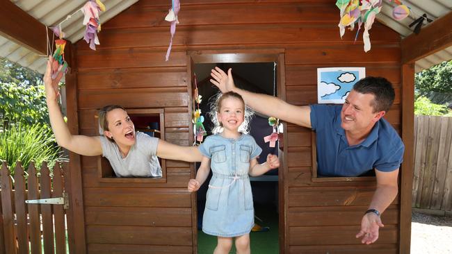 Paul and Kate Dimond with their daughter Bella, 4, celebrate money for free kinder in 2021. Picture: Alex Coppel.